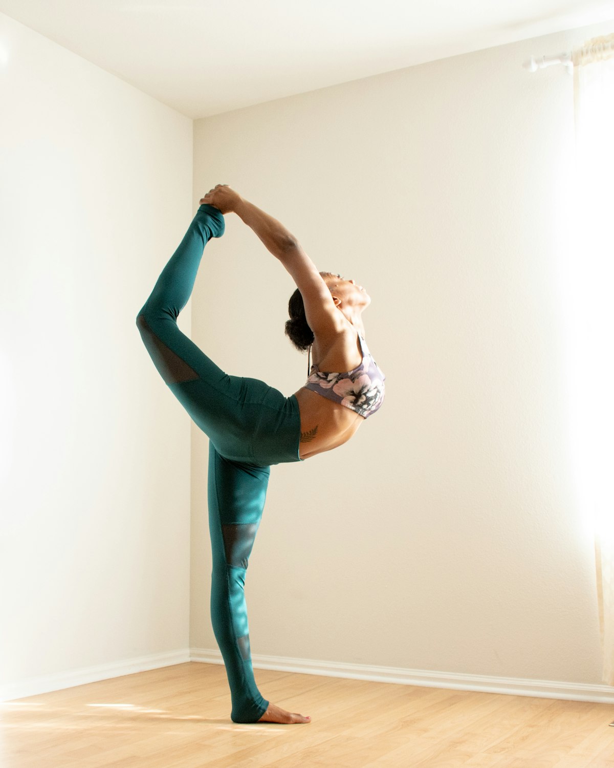 Dancer's pose in a bright, airy studio